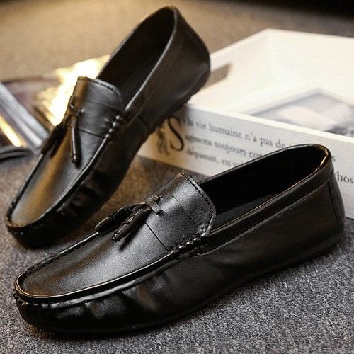 black flats with tassels