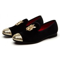 Black and gold store loafers with spikes