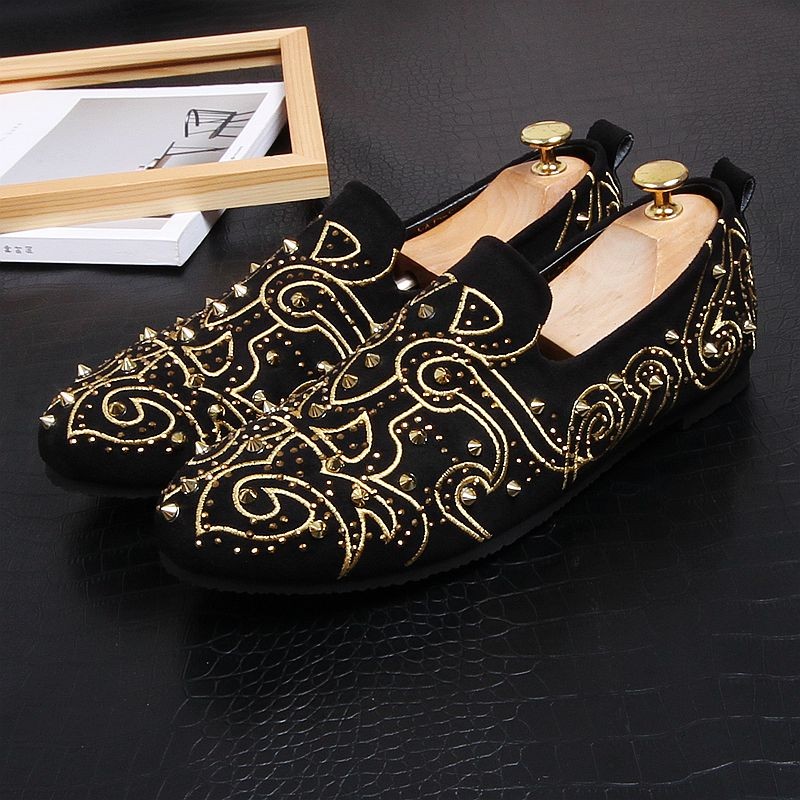 black loafers with gold spikes