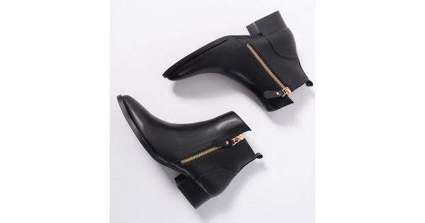 black shoes with gold zipper